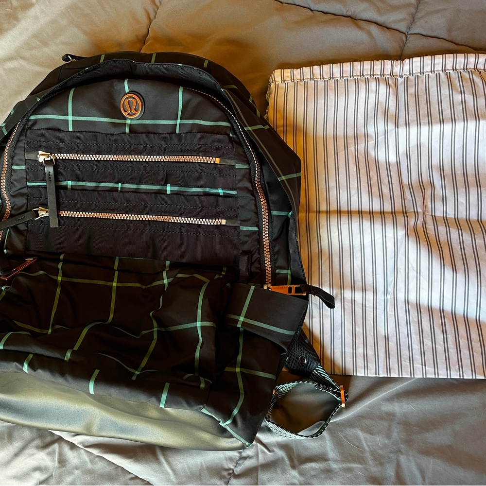 Lululemon Pack To Reality Backpack. Navy, green and rose gold